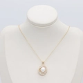 Elegant gold necklace with interlocking diamond circles and a white pearl on a bust - Double Ring Pearl Pendant (S-0149)