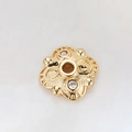 Macro shot of 14k gold plated bead spacers with zircon accents and hollow floral pattern - Spiral Pattern Double Diamond Spacer (H-8452/7.5MM)