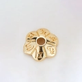 Macro view of 14k gold-plated flower spacer bead with engraved religious characters - Six-Character Mantra Six-Petal Bead (H-8468/10MM)