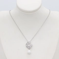 Macro detail of silver necklace featuring sparkling pavé diamonds and dual white pearls - Double Pearl Rhinestone Pendant (S-0150 Palladium)