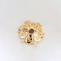 Macro view of 14k gold plated spacer bead with zircon petals and engraved symbols - Sanskrit Six-Diamond Disc Bead (H-8456/9MM)