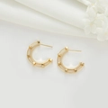 Detail of gold C-shaped earrings with unique double-rail hollow architecture and 925 silver pins - Dual-Track Hollow Geometric C-Shape Style (H-7492)