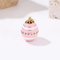 Macro shot of 14k gold Fabergé style egg pendant with pink enamel and pavé zircon details - Pink Stripe