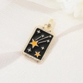 Detailed macro of 14K gold-plated tarot 'The Star' pendant with black enamel finish - Tarot Star Style (H-6945)