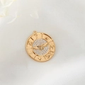 Macro shot of 14K gold plated eagle coin pendant with sparkling white zircons and relief - Eagle Relief Style (D1045)