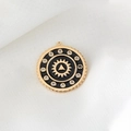 Detailed view of a circular gold-plated pendant with black enamel and zircon inlay - Sun Gear Style (D1038)