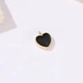 Macro view of heart pendant with black enamel center and gold beaded edge detail - Black Heart Style (H-9292 Black) / Gold