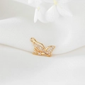 Macro shot of 14K gold-filled butterfly charm featuring sparkling cubic zirconia stones - Spreading Butterfly (H-7192)