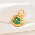 Detail view of round golden pendant with green cartoon character and relief wavy texture - D1459 (Snake - Enamel)