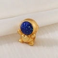 Detailed macro shot of a golden astronaut charm with a sparkling blue glitter visor face - Astronaut Heart Decoration Style (D1470)
