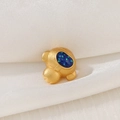 Detail of matte gold astronaut charm with blue starry glitter helmet on white silk - Astronaut Matte Gold Reclining Style (D1473)