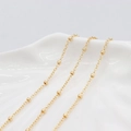 Minimalist 14K gold beaded chain necklace with frosted spheres on white ceramic plate - Gold Round Bead Design (AL-291)