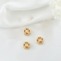 Detailed view of three 14K gold hollow round spacer beads for DIY jewelry making - Hollow Floral Bead (H-5936)