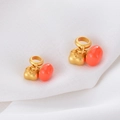 Macro detail of two gold persimmon charms with orange resin on white textured fabric - Matte Heart Pattern Orange Decoration (D1340 Pumpkin)