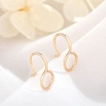 Detail of 14K gold plated spiral ear clip on white fabric with soft macro focus - Real Gold Plated High Color Retention / 14K Gold D185