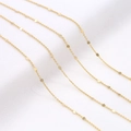 Macro shot of 14K gold plated O-chain with small round sequins for DIY jewelry making - 1mm / 14K Gold AL-195