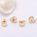 Dettaglio di quattro perline scorrevoli in ottone placcato oro 14k per gioielli fai da te - Oro 14K