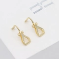 Close-up of 14K gold plated horseshoe ear clips with a polished mirror finish detail - 14K Gold Plated Style (H-0883-1)