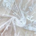 White minimalist Nordic lace tablecloth with elegant floral patterns on a wooden surface - 100x140 / White