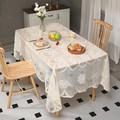 Detail of white lace tablecloth showing intricate hollow patterns and scalloped edges - 150x250cm / Beige