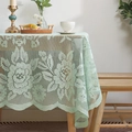 Minimalist light green lace tablecloth with fine floral embroidery on a wooden dining table - 150x150cm / Pale Olive Green
