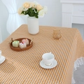 Yellow and white checkered linen tablecloth featuring delicate white lace border trim - Orange