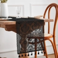 Close-up of black lace table runner with intricate hollowed patterns and fringe tassels - Black Beauty 4 / 30*45