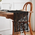 Close-up of black floral lace table runner with delicate tassels on a wooden dining table - Black Beauty 1 / 30*45