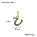 Macro shot of green enamel letter U pendant with gold trim and size 0.9cm measurement - Letter U