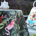 Round tablecloth featuring vibrant tropical rainforest flamingo and green leaf prints - Midnight Black Flamingo