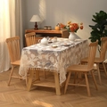 Lace tablecloth with floral jacquard and fringe tassels on a rustic wooden table - Beige Tulip