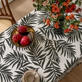 Mantel nórdico de algodón y lino con motivo de hojas de palma y borlas negras - 150x100