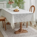 Close-up of white crochet lace tablecloth featuring intricate floral patterns and tassels - 150*230cm / Thick White