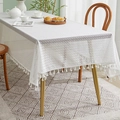 Detail of white rectangle lace tablecloth with Greek key patterns and hanging pom-pom tassels - 140x100CM / White