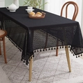Detailed close-up of black lace hollowed tablecloth with geometric patterns and tassels - 140x100CM / Black