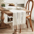 Cream woven table runner with geometric textures and elegant tassels on a wooden table - Triple Double-Eight Knot Long Tassel Beige