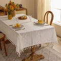 Detail of floral lace embroidery and beige tassels on a vintage rectangular tablecloth - White Plum Blossom Tassel