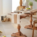 Bohemian style woven table runner with beige stripes and fringes on a wooden table - 30x240cm / Khaki With Tassels
