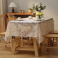 Bohemian cream lace tablecloth with floral embroidery and elegant tassel fringe detail - Hummingbird
