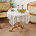 Elegant white lace round tablecloth with hollow floral pattern and wavy edges on a wooden table - 90x90cm / White Plum Blossom