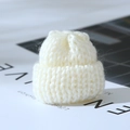 Mini knitted off-white Christmas hat ornament with soft yarn texture for holiday decor - Creamy White Christmas Hat