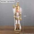 Detail of 40cm gold and white wooden nutcracker king ornament with glitter and scepter - Nutcracker - Large Gold King