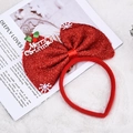 Detailaufnahme des roten Pailletten-Weihnachtshaarreifens mit großer Schleife und Dekor - Rot