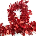 Detail of red festive tinsel garland with shiny round sequins for holiday party decoration - Plain Style / Red