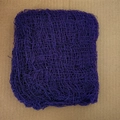 Detailed view of the purple mesh fabric texture for Halloween party decoration - Purple