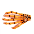 Makroansicht der leuchtend orangefarbenen Skeletthand-Haarklammer mit schwarzen Details - Orange