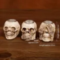 Three-piece resin skull set with hear-see-speak no evil pose and candle holder - Hear/See/Speak No Evil Set (7150G-02) / Three-Piece Set