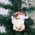 Clochette de Noël Père Noël avec bonnet rouge suspendue sur un sapin décoré - Père Noël