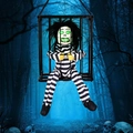 Halloween hanging prisoner ghost in cage with glowing green eyes and striped clothing - Striped Afro Cage Ghost