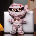 Momie en peluche avec rayures mauves, yeux orange et nœud citrouille pour Halloween - Momie / 30cm